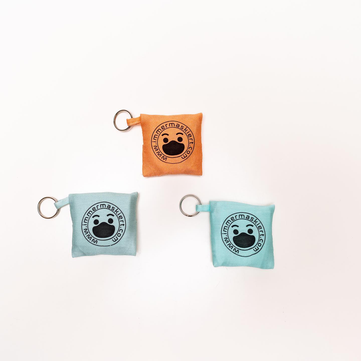 Stylische Stofftasche mit nicht-medizinischer Gesichtsmaske | Praktisch am Schlüsselbund