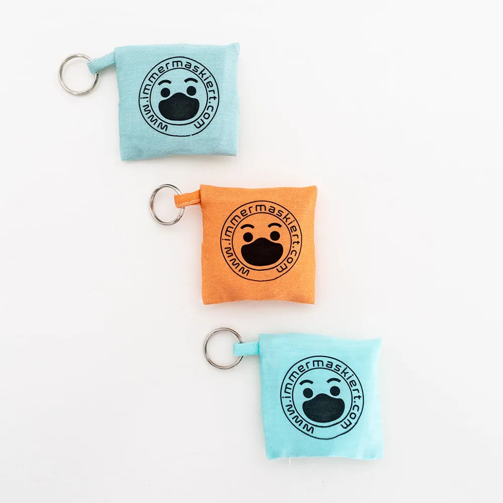 Stylische Stofftasche mit nicht-medizinischer Gesichtsmaske | Praktisch am Schlüsselbund