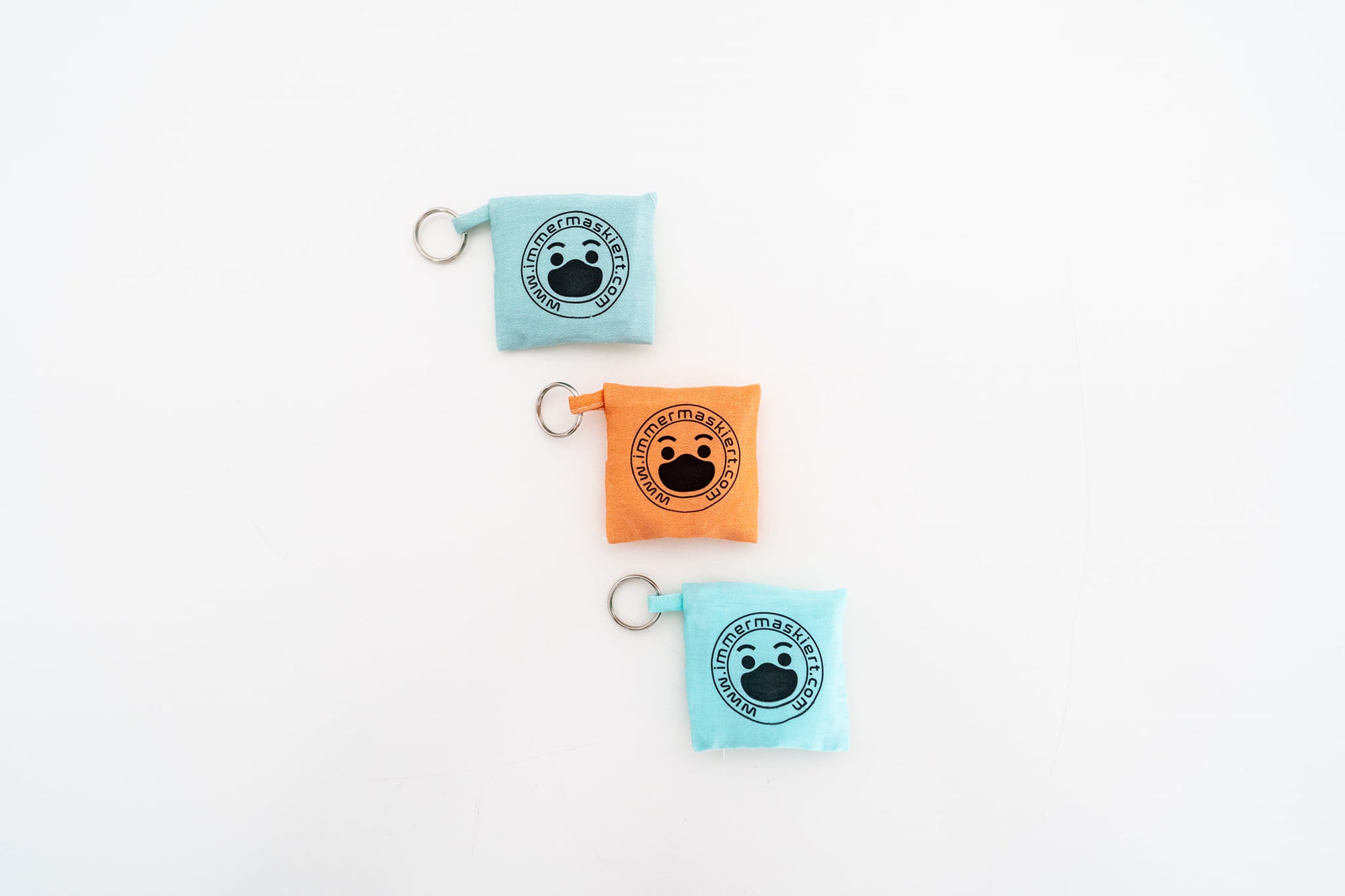Stylische Stofftasche mit nicht-medizinischer Gesichtsmaske | Praktisch am Schlüsselbund