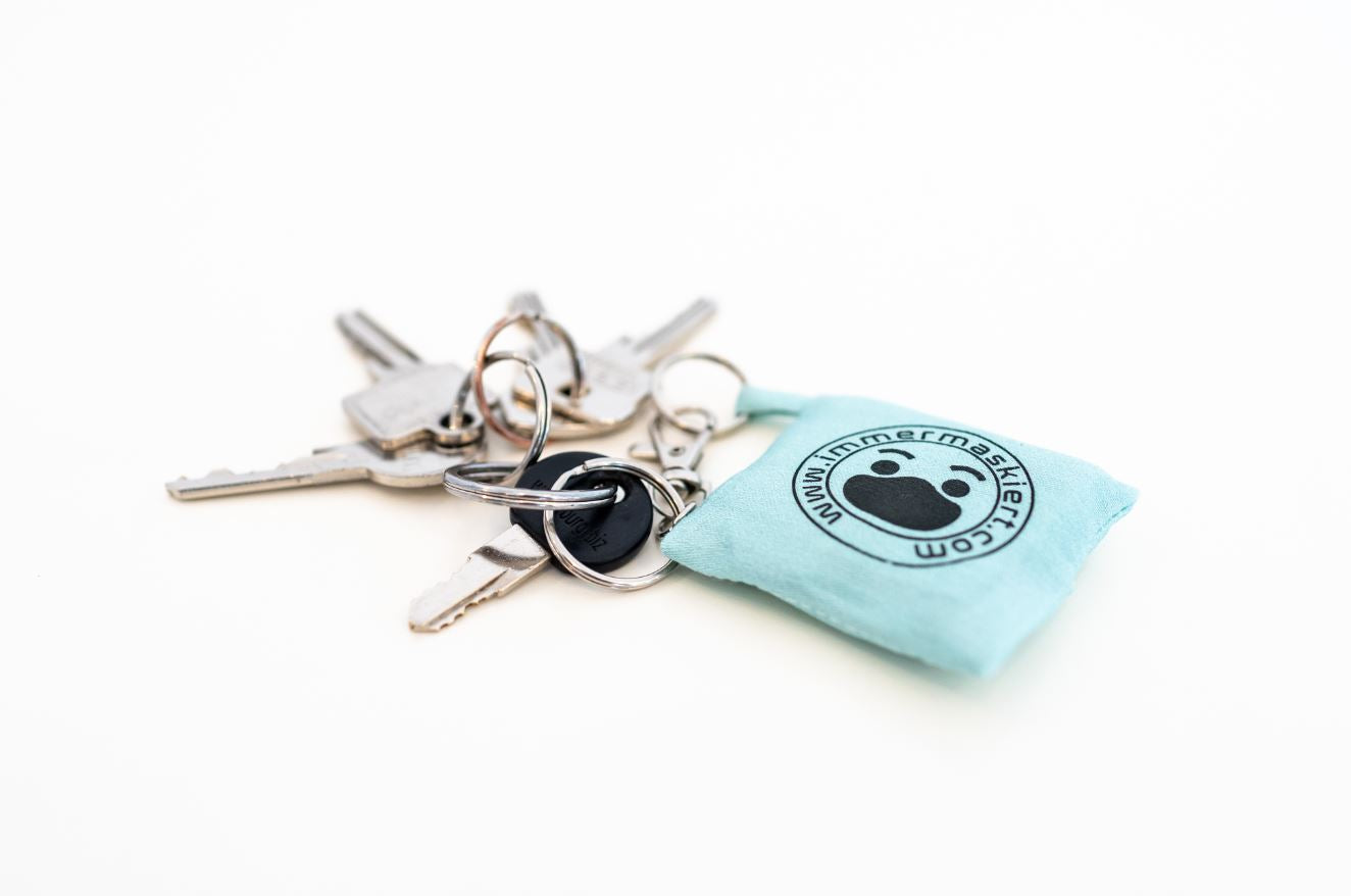 Stylische Stofftasche mit nicht-medizinischer Gesichtsmaske | Praktisch am Schlüsselbund