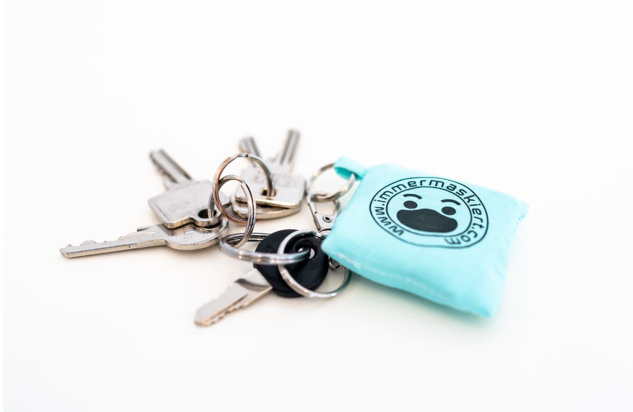 Stylische Stofftasche mit nicht-medizinischer Gesichtsmaske | Praktisch am Schlüsselbund